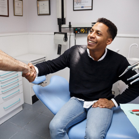 Patient smiling at dentist in treatment chair
