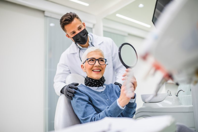 An older senior woman receiving care from her dentist